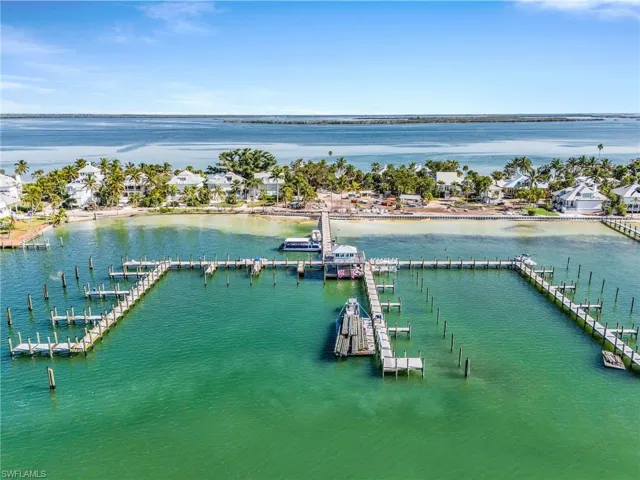 Drone / aerial view of a large body of water and numerous boat docks