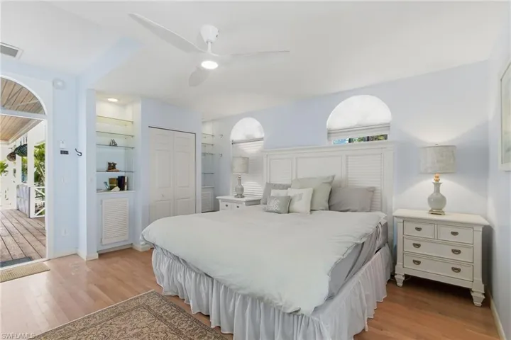 Bedroom featuring a closet, light wood-style floors, and a ceiling fan