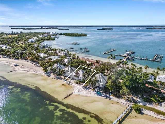 Aerial overview of property's location featuring property boundaries highlighted and a nearby body of water