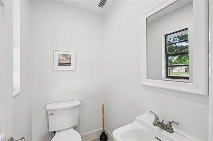 Bathroom featuring toilet and tile patterned floors