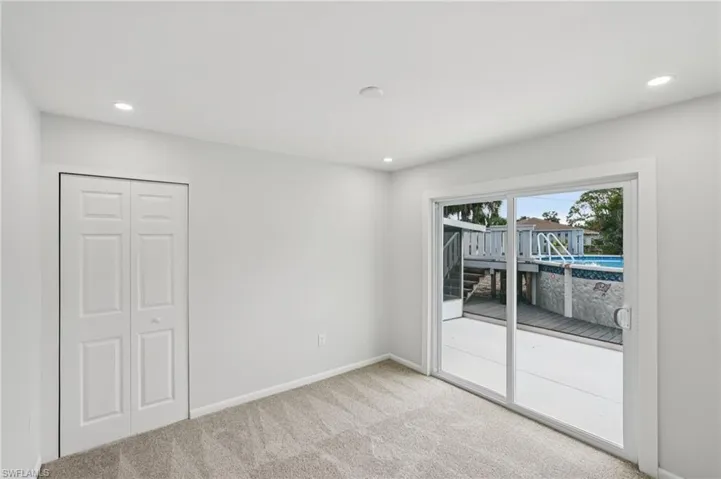 Unfurnished room featuring light carpet and recessed lighting