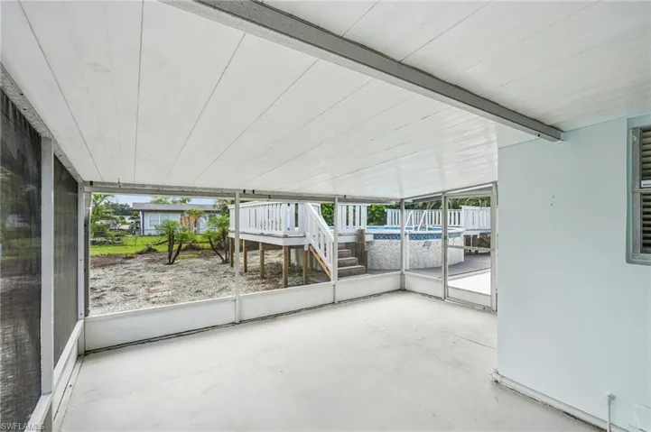 Sunroom / solarium with beamed ceiling