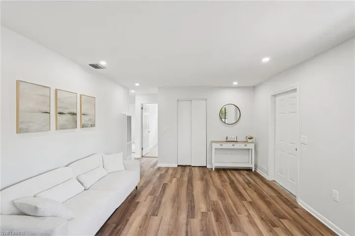 Living area featuring recessed lighting and wood finished floors