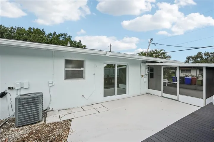 Rear view of property featuring a patio and stucco siding