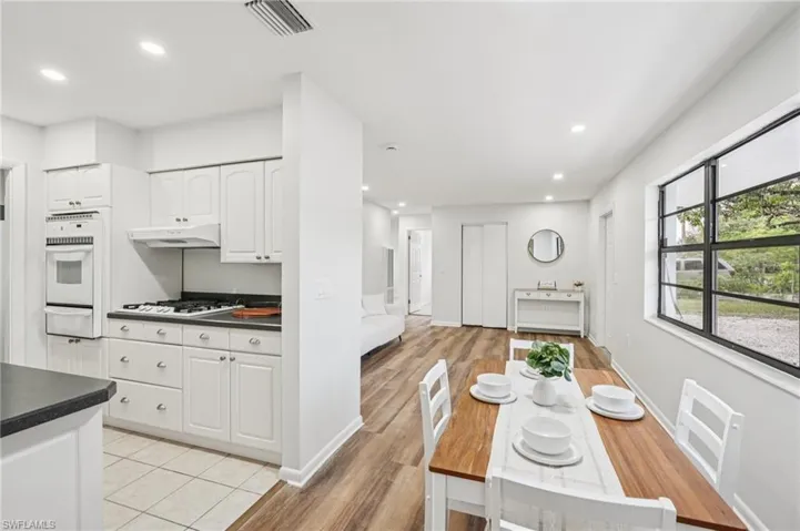 Dining space featuring recessed lighting and light wood-type flooring