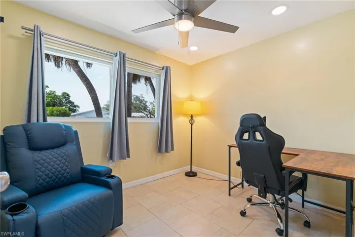 Office space with recessed lighting, a ceiling fan, and light tile patterned floors