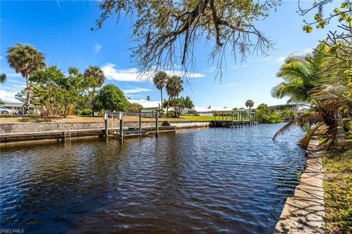 Water view with a dock and boat lift