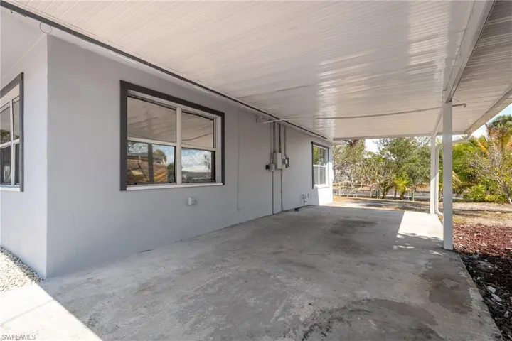 View of patio / terrace featuring a carport