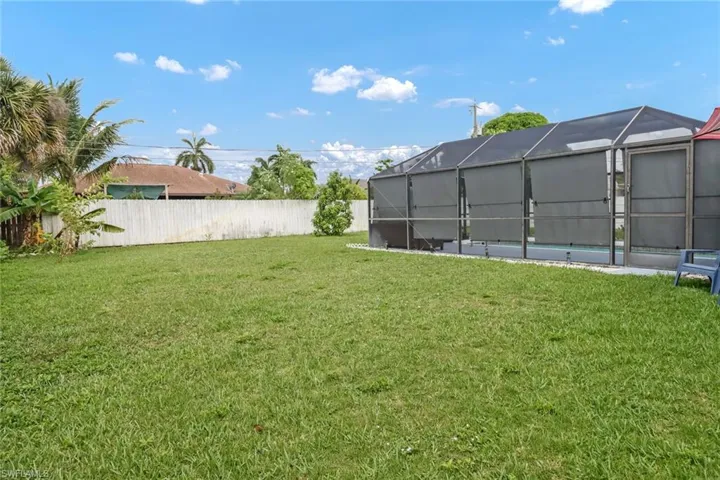 View of yard with a lanai