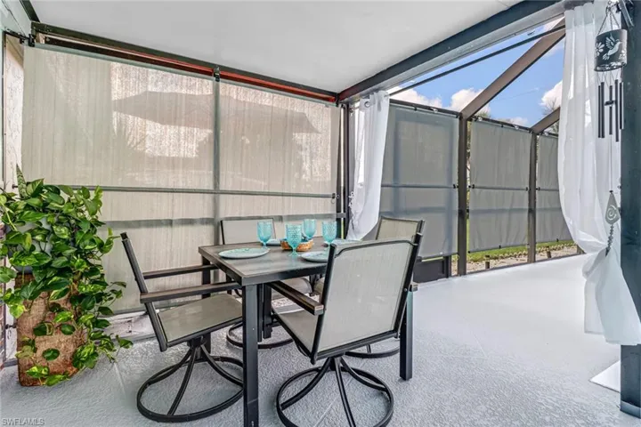 Sunroom / solarium with outdoor dining space