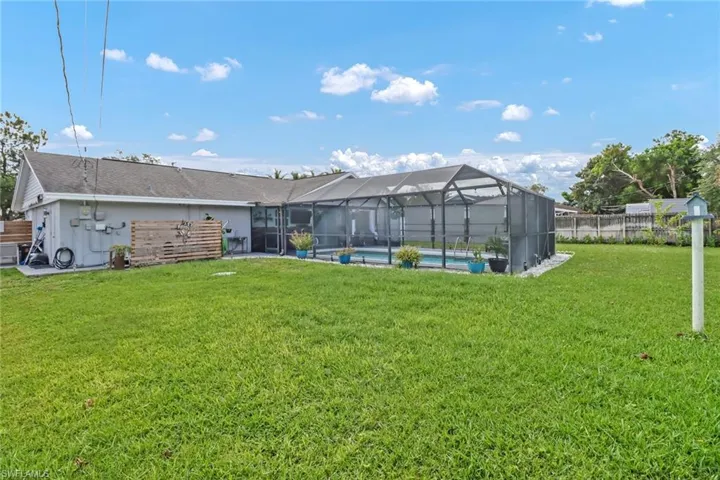 View of yard with a lanai
