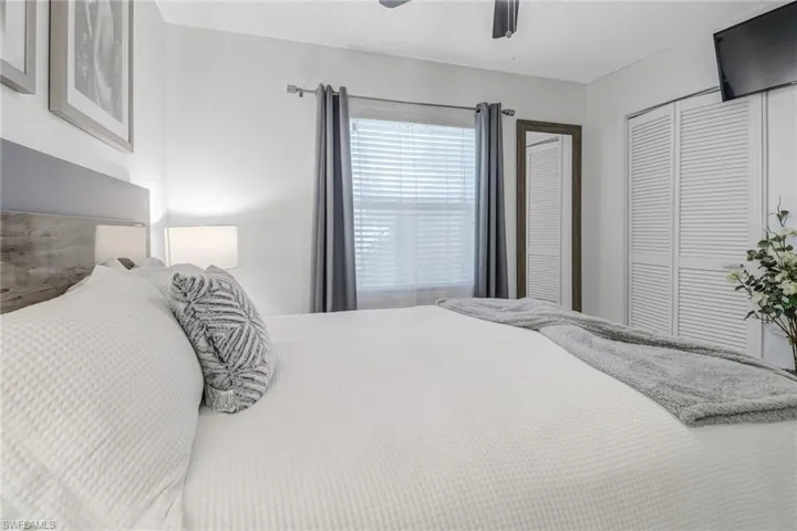 Bedroom with a closet and a ceiling fan