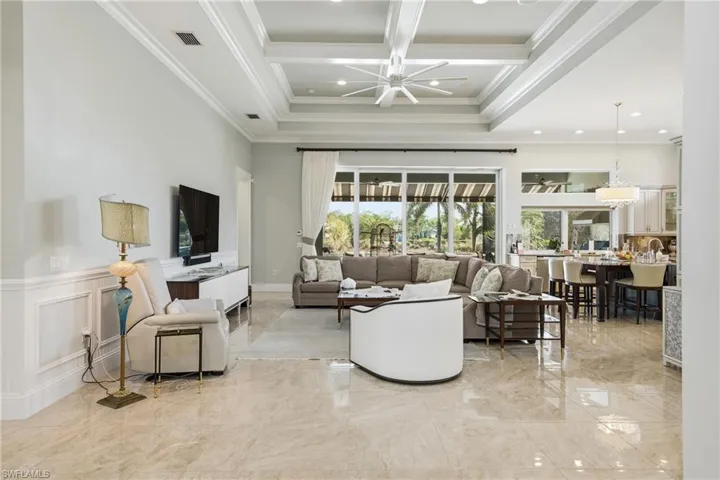 Open great room with soaring ceilings and elegantarchitectural details