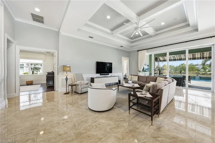 Open great room with soaring ceilings and elegantarchitectural details