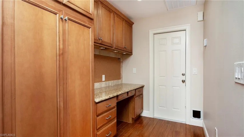 Enter from Garage to this galleyway to kitchen with built-in desk
