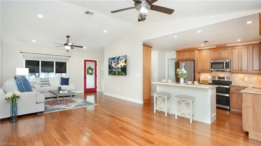 Open kitchen, living, dining rooms w/Vaulted Ceilings