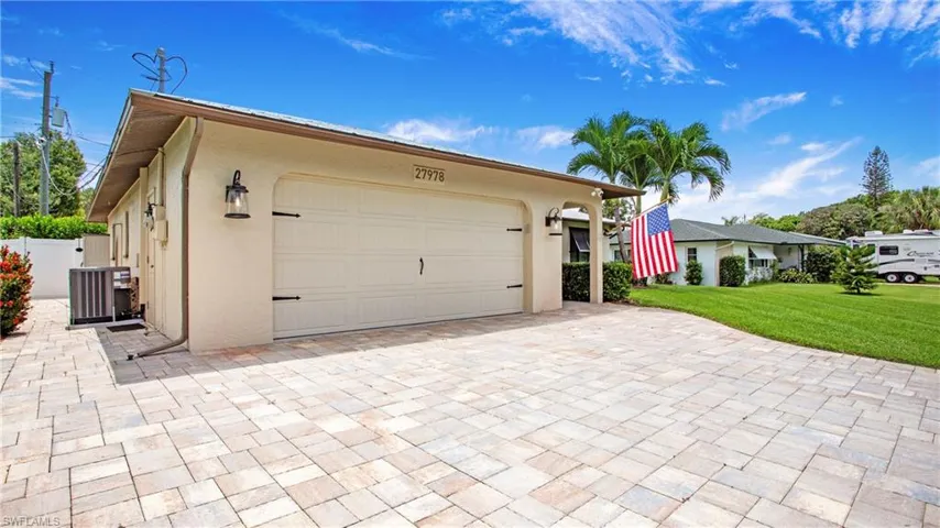 Paver driveway extends to back of house