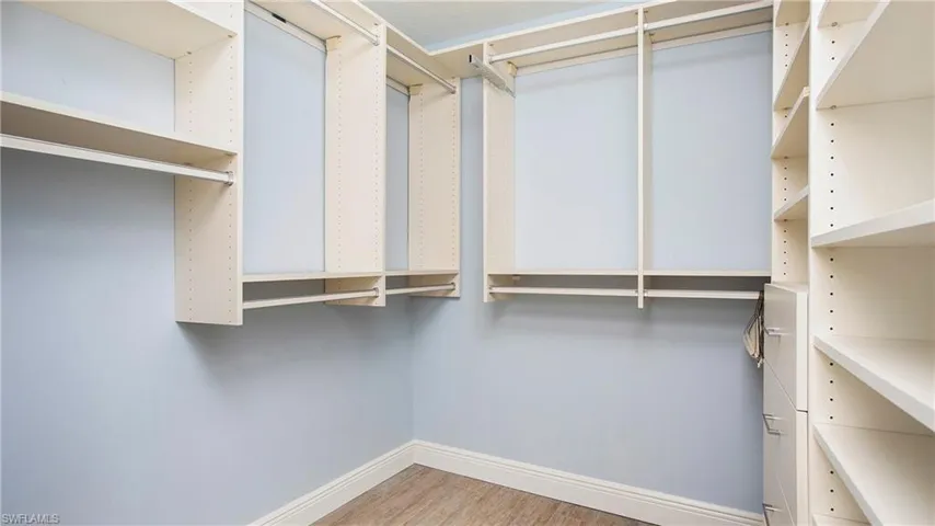 Primary Bedroom has walk in closet with many extras