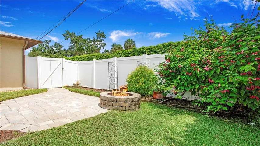Fenced yard with fire pit