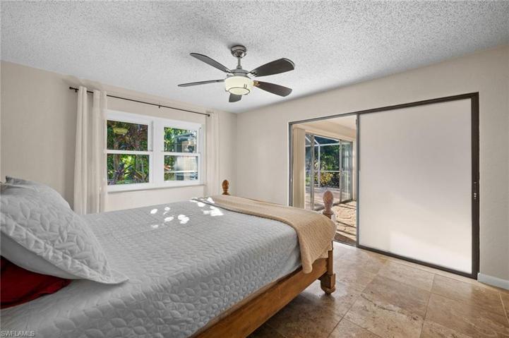 Master Bedroom with patio sliders to siting area.