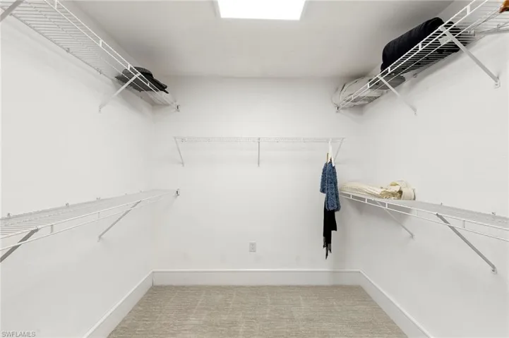 Walk in closet featuring carpet