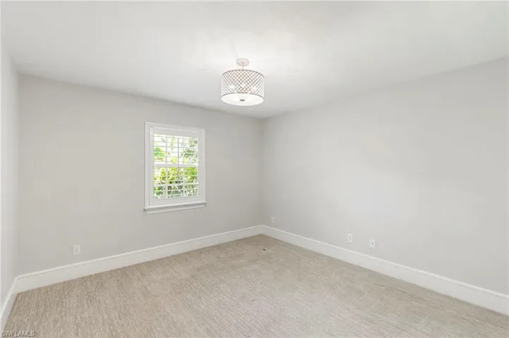 Spare room featuring carpet floors