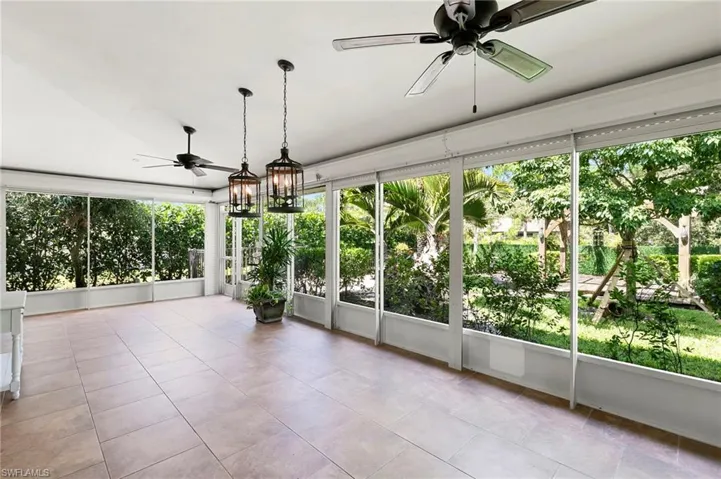 Unfurnished sunroom with tile patterned flooring