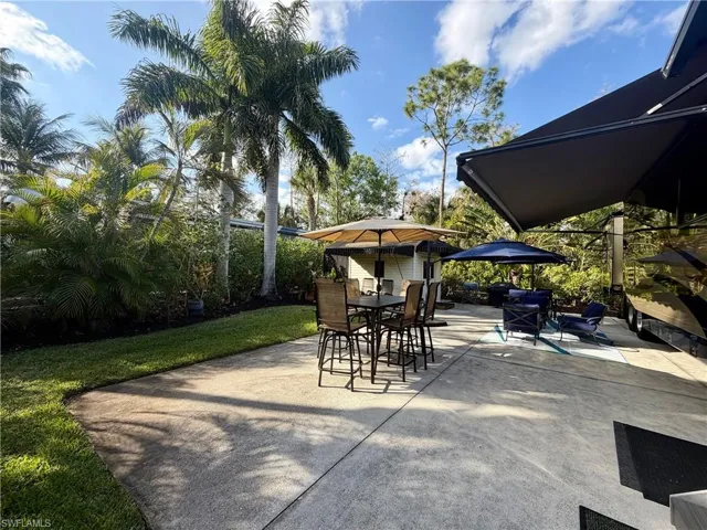 View of patio with outdoor dining area
