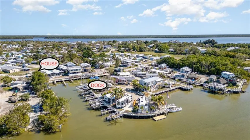 Aerial view of property's location with a nearby body of water