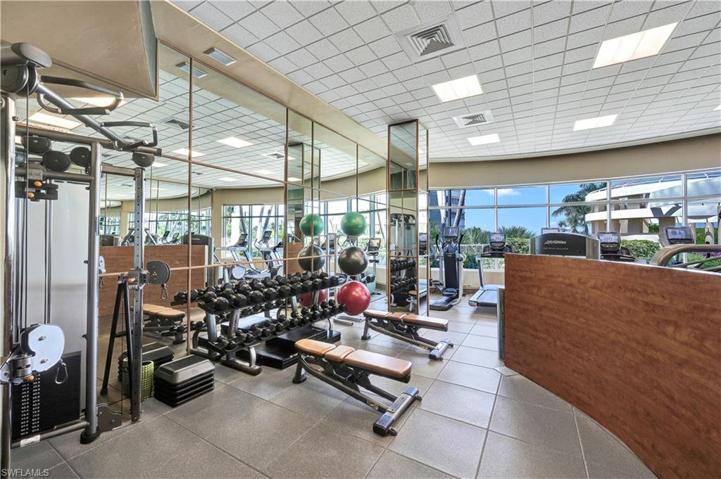 Full Gym with equipment overlooking the Pool and Gulf of Mexico