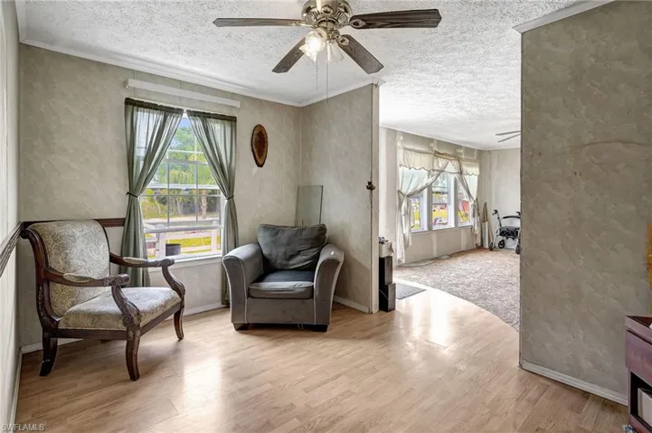 Dining room located between kitchen and living room. Currently set up as a sitting area.