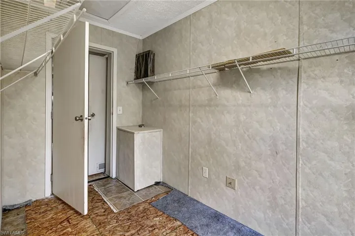Walk-in closet with access from the master bedroom and bathroom.