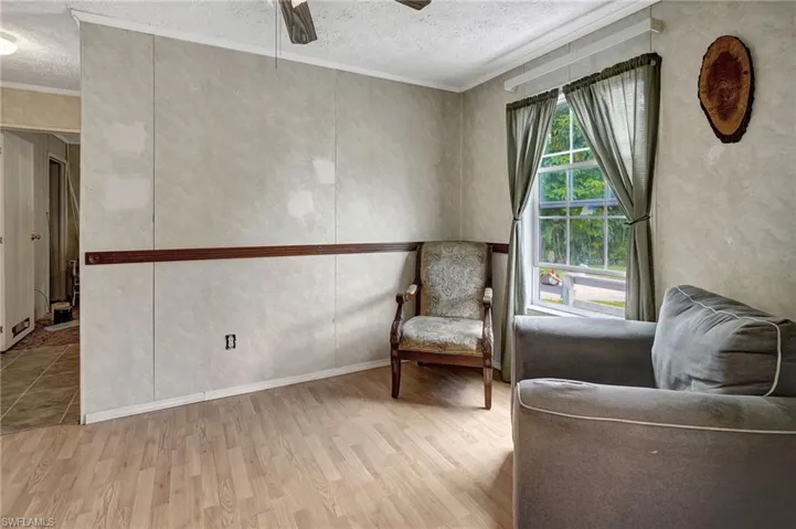 Dining room located between kitchen and living room. Currently set up as a sitting area.