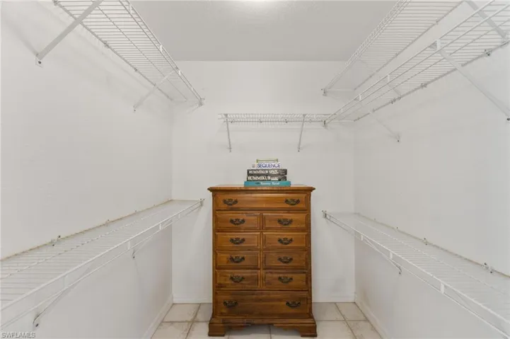 Walk in closet featuring light tile patterned floors
