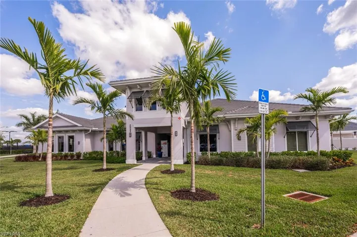View of front of house with stucco siding and a front yard