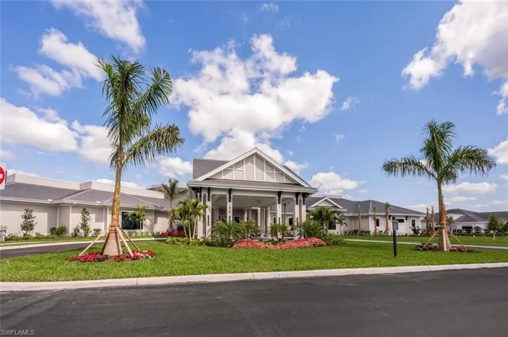 View of front of house featuring a residential view, board and batten siding, and a front yard