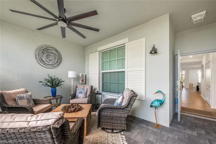View of patio with visible vents, an outdoor hangout area, and ceiling fan