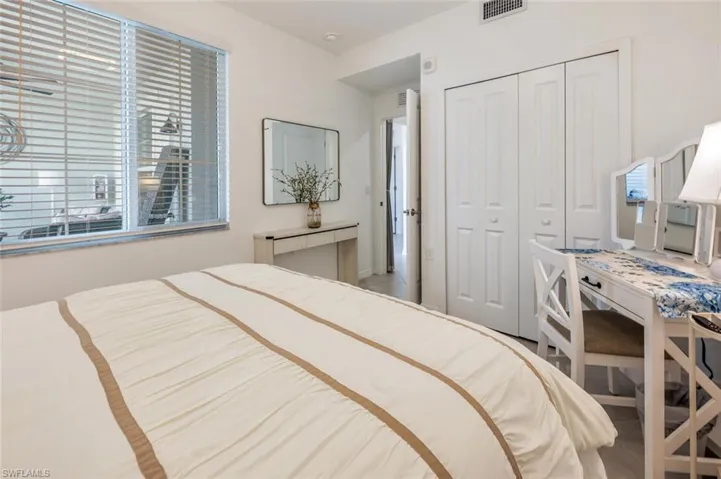 Bedroom with a closet and visible vents