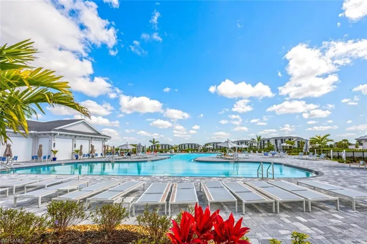 Pool with a patio and fence