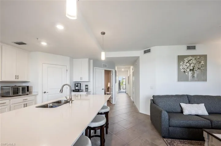 Kitchen with a sink, visible vents, and a kitchen bar