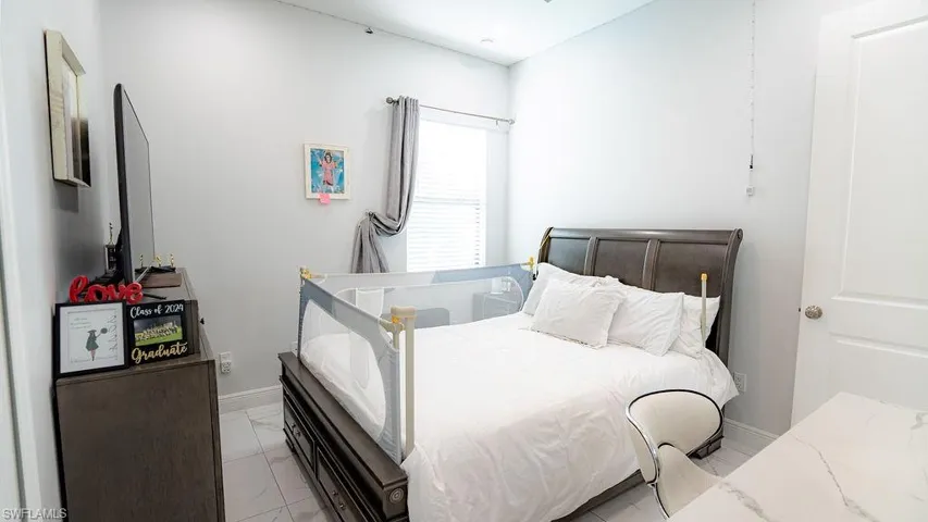 Neutral-toned walls complement the tile flooring