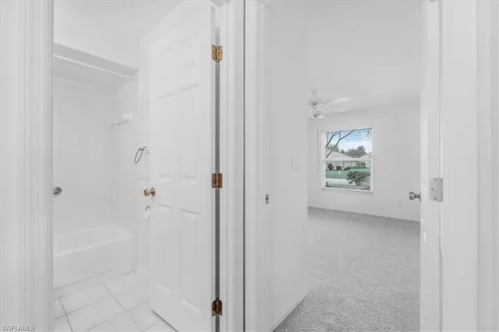 hall Bathroom featuring tub / shower combination, outside bedroom 2