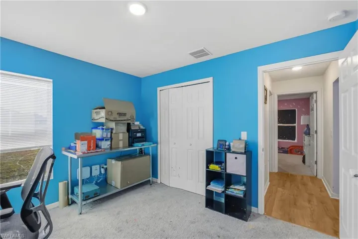 Office area with light colored carpet