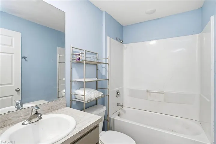 Bathroom featuring vanity and shower / bath combination