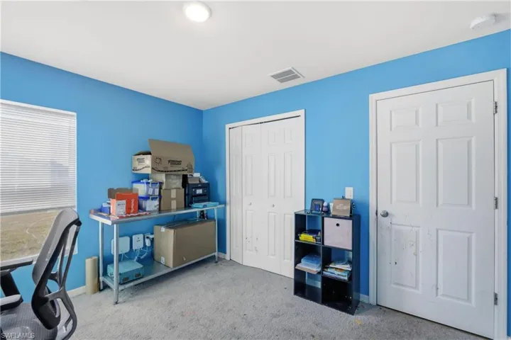 Office with carpet floors and baseboards