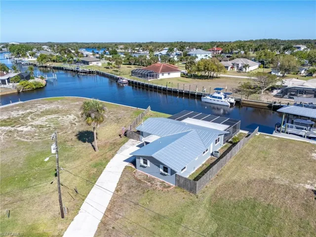 Aerial view of residential area featuring a large body of water