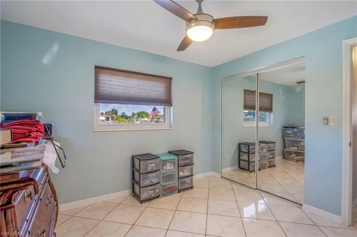 Office space featuring baseboards and ceiling fan