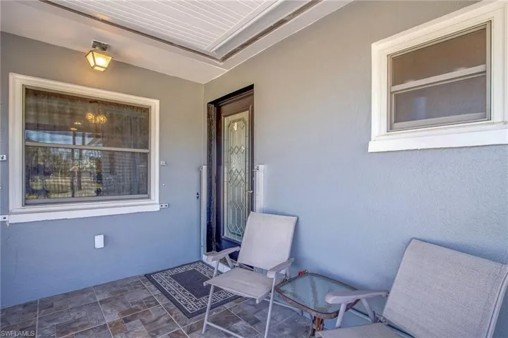 Property entrance with stucco siding