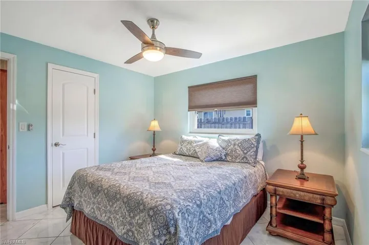 Bedroom featuring baseboards and ceiling fan