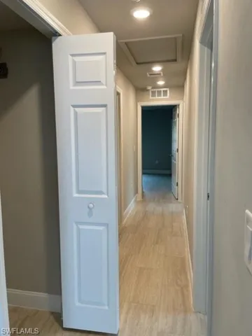 Hall featuring light hardwood / wood-style flooring